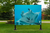 Outdoor panel showing an underwater photo of a sting ray